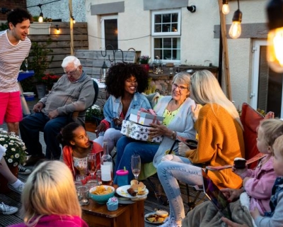 People gather at an outdoor party