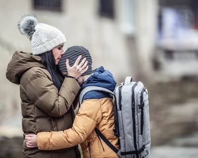 Woman kisses her boy